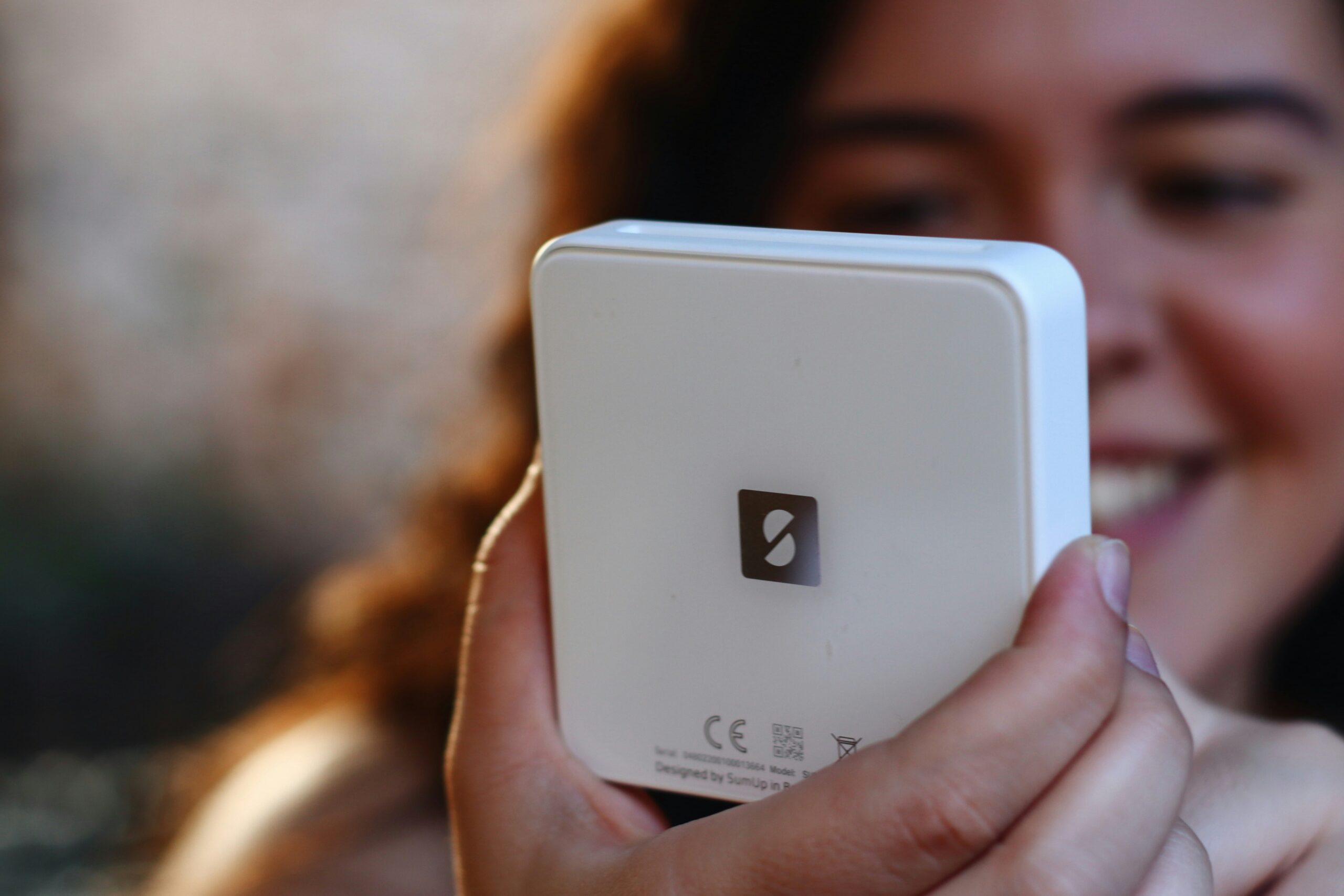 a close up of a person holding a cell phone